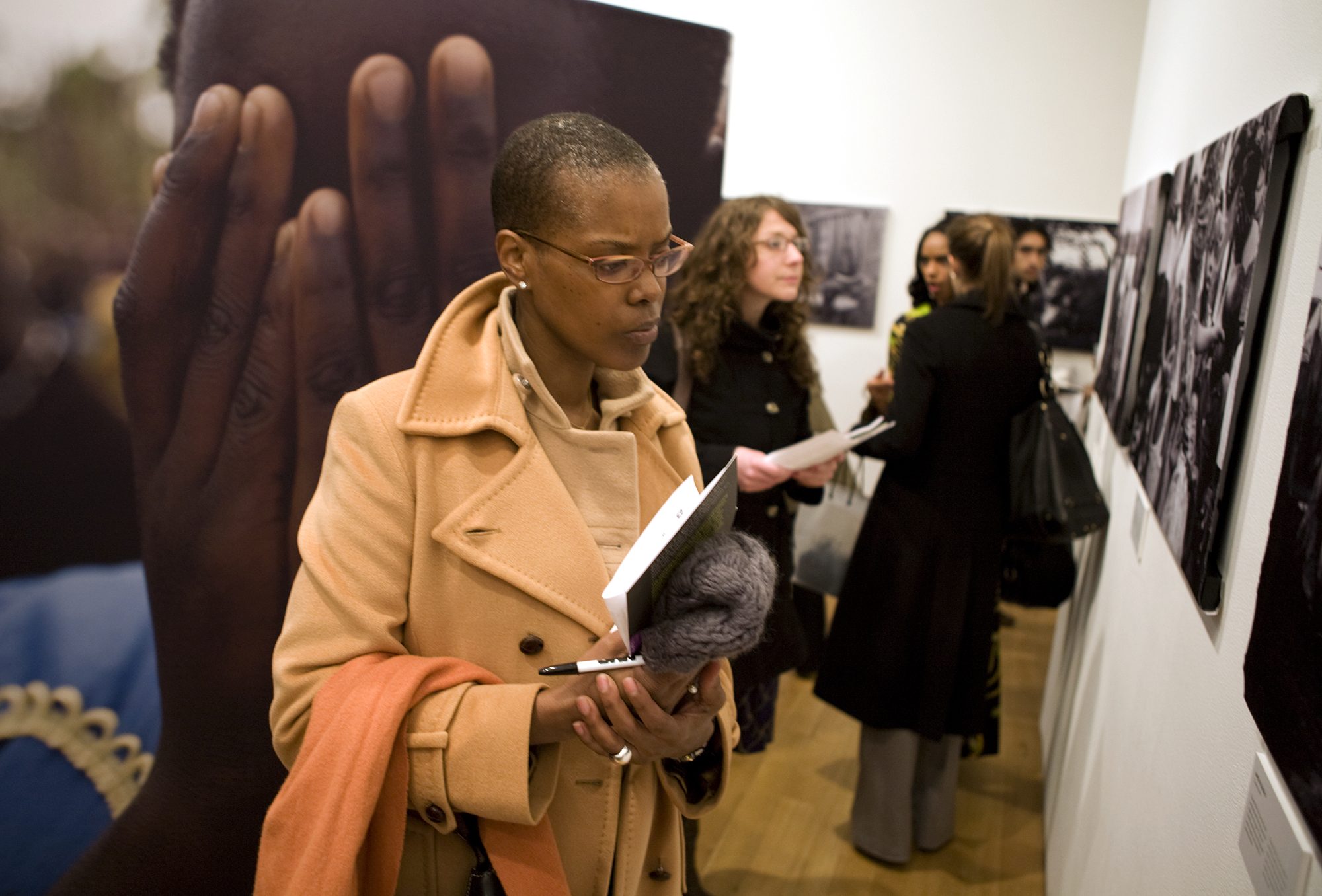 A few people look at an exhibition of Congo Women in New York