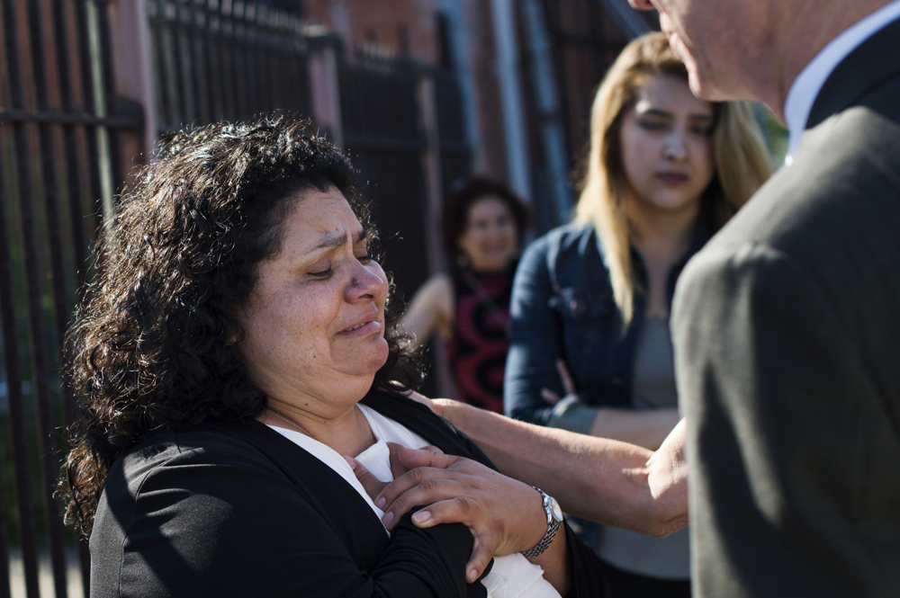 Lourdes Salazar Bautista puts her hands to her heart as she expresses concern for her children, moments after leaving the meeting confirming her deportation order on Monday, July 31, 2017 outside the ICE Enforcement and Removal Operations Office in Detroit, Michigan, USA