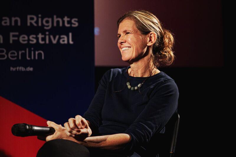 Leslie Thomas, seated, smiling